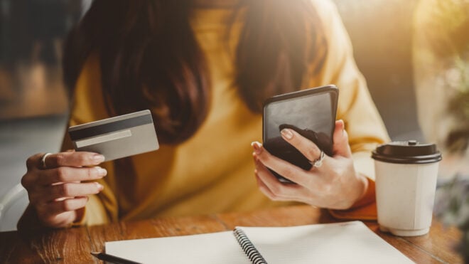 woman holding credit card