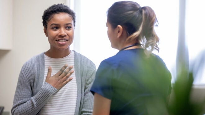 woman talking to doctor