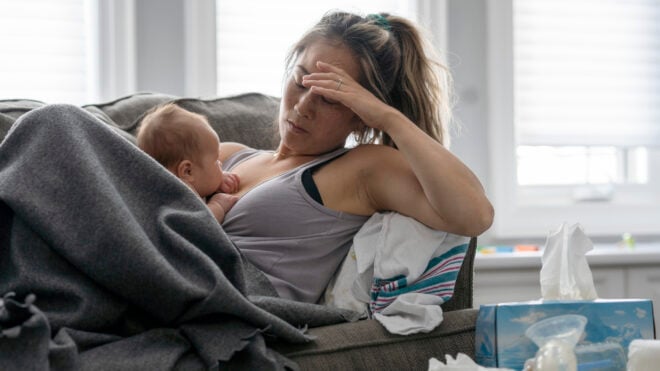 exhausted mom with newborn