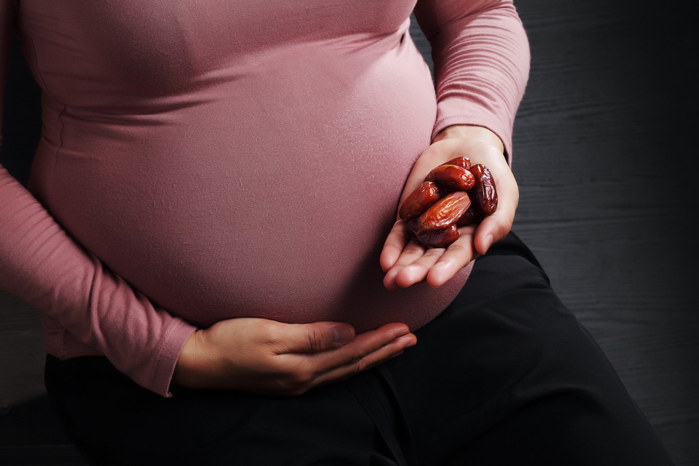 Pregnant holding dates
