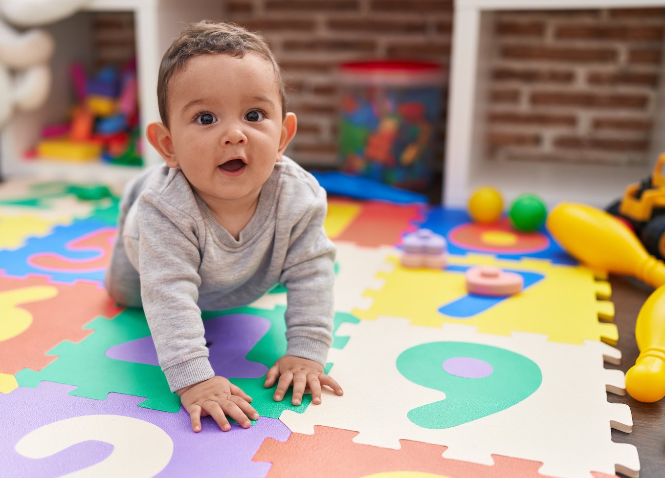Baby boy on a play mat