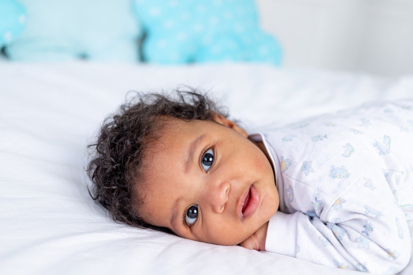 Baby boy on a bed