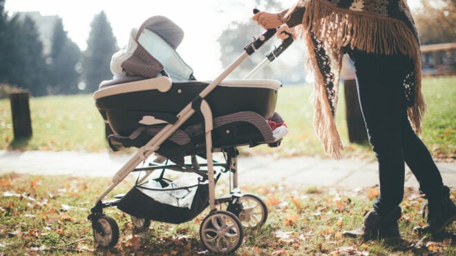 woman pushing stroller
