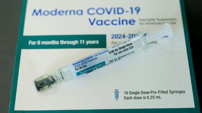 In this photo illustration, a Moderna COVID-19 vaccine fills a syringe at Borinquen Health Care Center on May 29, 2025, in Miami. Health and Human Services Secretary Robert F. Kennedy Jr. announced that he will no longer recommend that healthy children and pregnant people get COVID-19 shots. (Photo illustration by Joe Raedle/Getty Images/TNS)