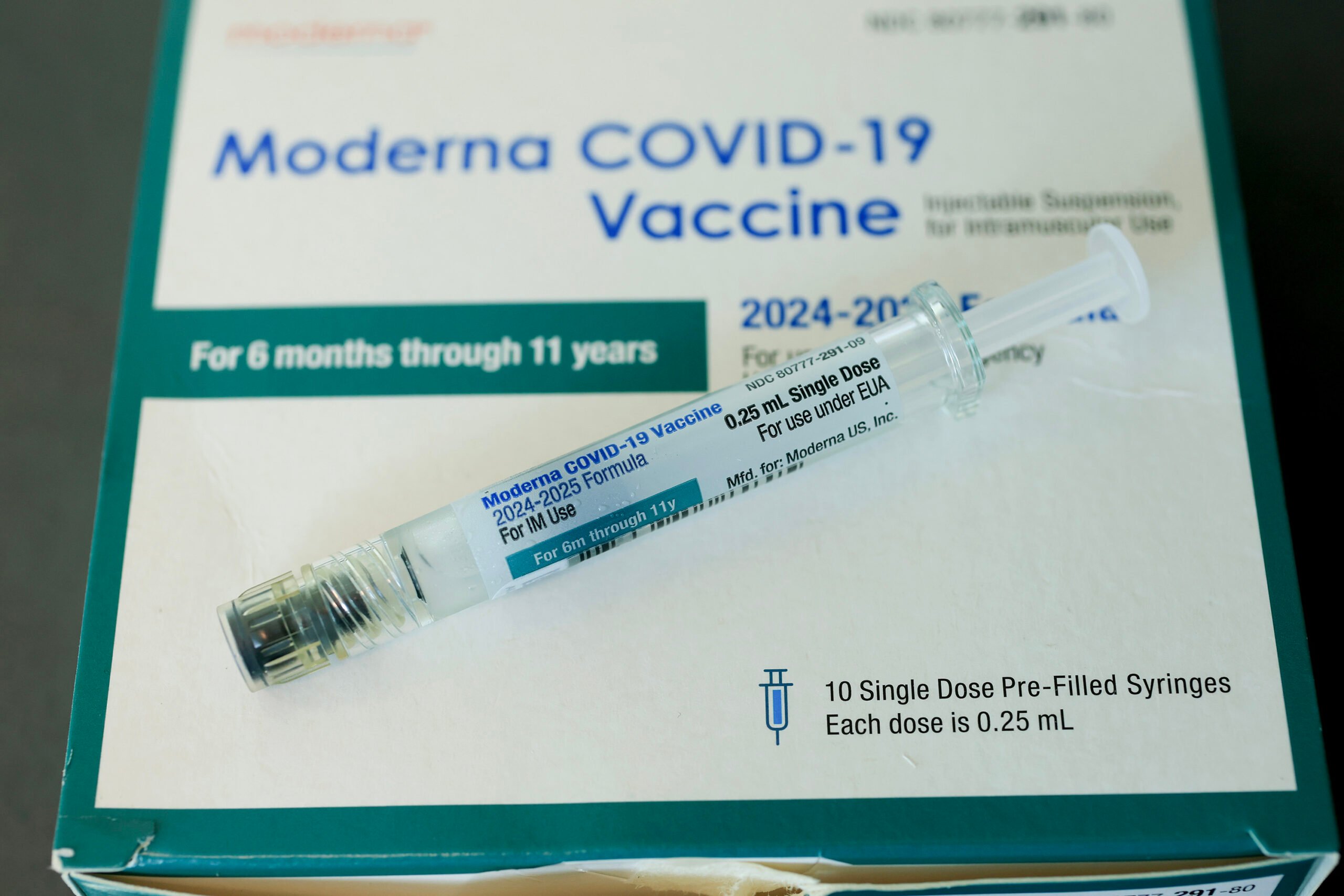 In this photo illustration, a Moderna COVID-19 vaccine fills a syringe at Borinquen Health Care Center on May 29, 2025, in Miami. Health and Human Services Secretary Robert F. Kennedy Jr. announced that he will no longer recommend that healthy children and pregnant people get COVID-19 shots. (Photo illustration by Joe Raedle/Getty Images/TNS)